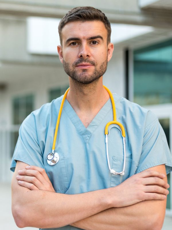 male-nurse-with-stethoscope-GZDHN3C
